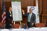 Acting Administrator Wheeler stands with Acting Assistant Administrator Barry Breen as they unveil the unified recycling pledge