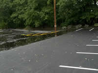 This picture shows the difference between the traditional pavement (on the left) and the porous pavement (on the right).