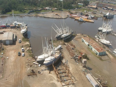 Aerial view of harbor with multiple beached ships after Hurricane Katrina