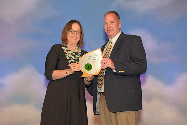 Micah Reed accepts Excellence in Education and Outreach Award for City of Fort Worth.