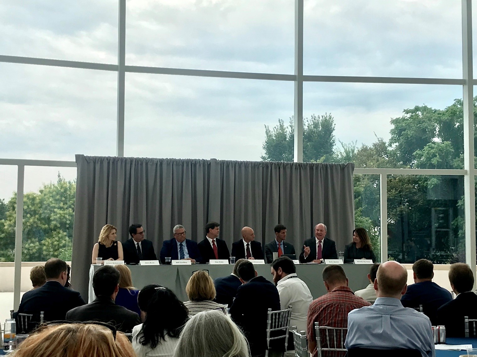 A group of people sitting at a very large table