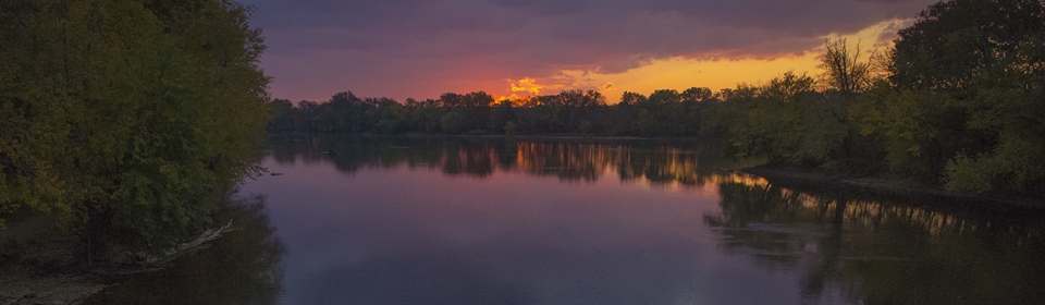 Photo of a sunset on a lake.