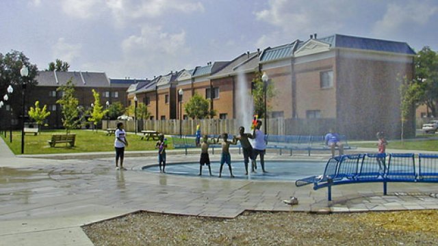 Children playing in fountain in East Russell neighborhood, Louisville, KY. Photo courtesy of Dr. John Gilderbloom.