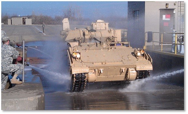 Soldiers at Ft. Riley wash a dirty vehicle