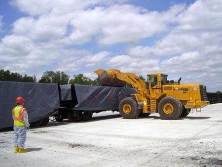 Rail cars are loaded with dredged and processed materials for delivery to permitted, off-site disposal facilities.