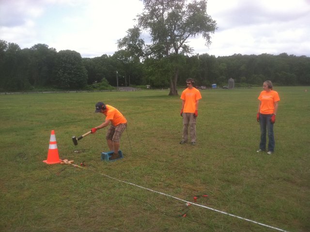 Picture of seismic refection data collection showing hammer source and geophones