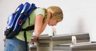 Child drinking from water fountain