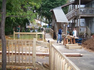 Volunteers work on the construction of ReFocus Outreach Ministry community recreational area and garden.