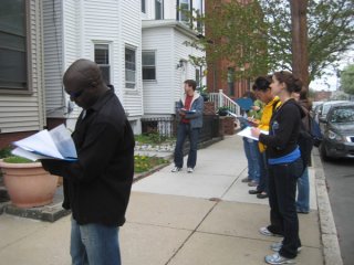 Volunteers point out lead paint issues on the outsides of houses that might be a health risk the residents.