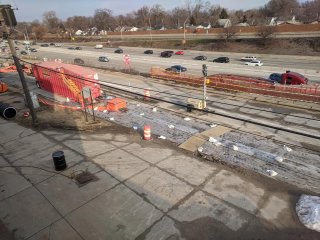 Photo of completed interceptor trench and frac tank along the service drive