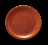 a red ceramic plate