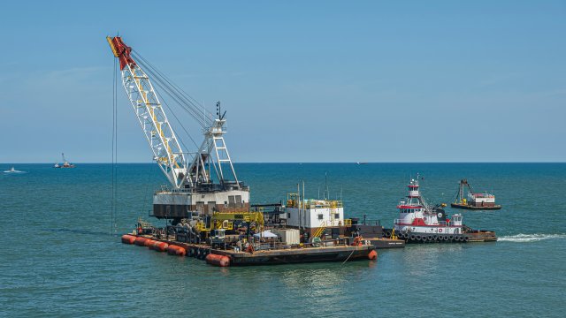 crane dredging in ocean