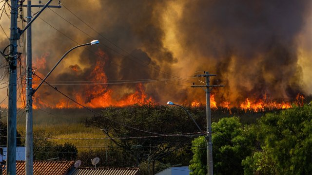 Wildfire shown in an urban area during the 2021 Dixie Fire in California