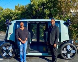 Administrator Regan in front of electric vehicle in Calif