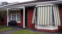 Image of the outdoors of a house with window covers