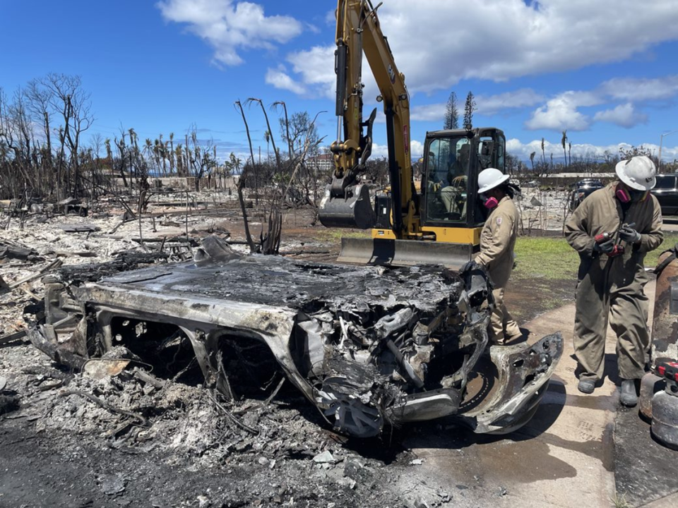 EPA crews upend an electric vehicle to remove the battery pack. Any remaining energy will be discharged before preparation for shipping. 