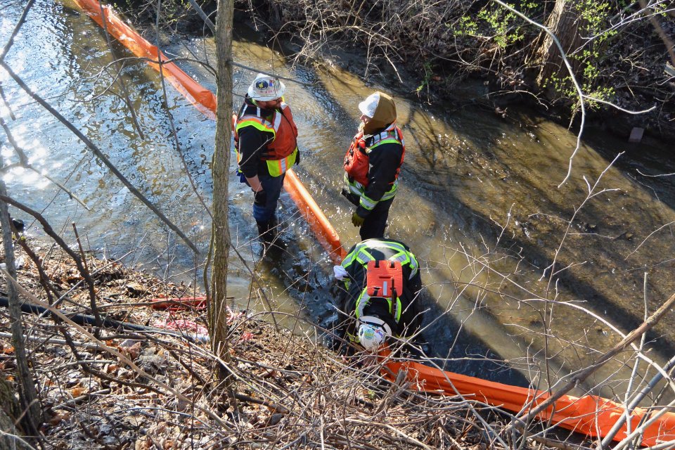 Crews set boom in Sulphur Run