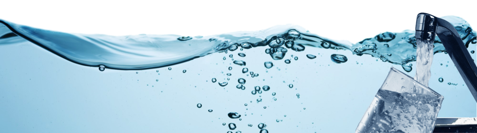 Wave of blue water with a glass being filled with water from kitchen faucet in forefront.