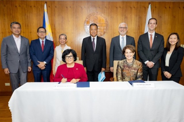 Signing Ceremony with EPA and Philippine Representatives standing behind white table