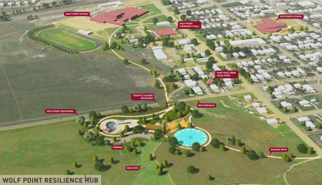 Shows a design rendering of several community elements, including a park, trails, and resilience hub within the community