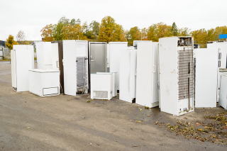 Large appliances in a junkyard.