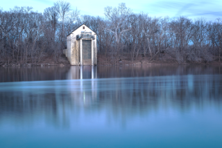 Drinking water intake building on a riverbank.