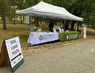 Soil lead tests sign and tent