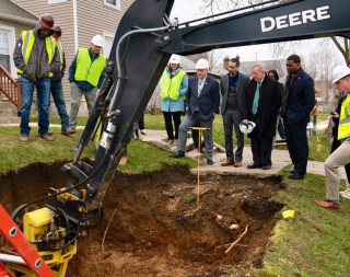 Administrator Regan and work crew excavating a yard