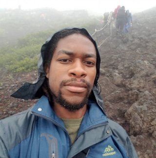 Researcher somewhere along a rocky trail in the fog