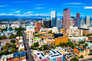 Aerial view, with brilliant blue sky in background of city of Denver Colorado. 