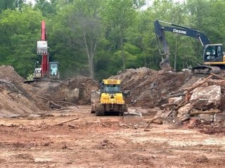 Excavaction equipment in use at a site