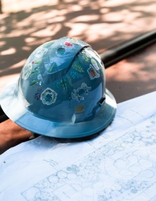 Hard hat sitting on blue prints