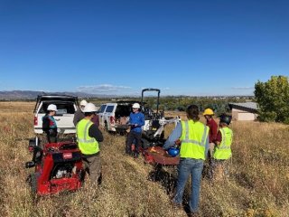 Workers from the city, state, and county doing a site visit at an air monitoring site.