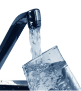 stock image of a glass of water being filled from a faucet